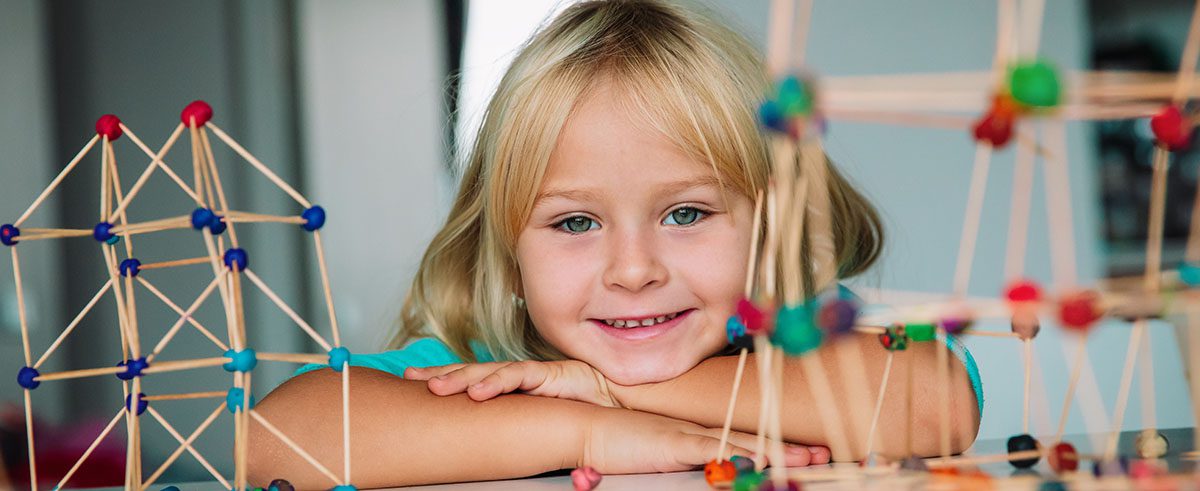 child making geometric shapes, engineering and STEM