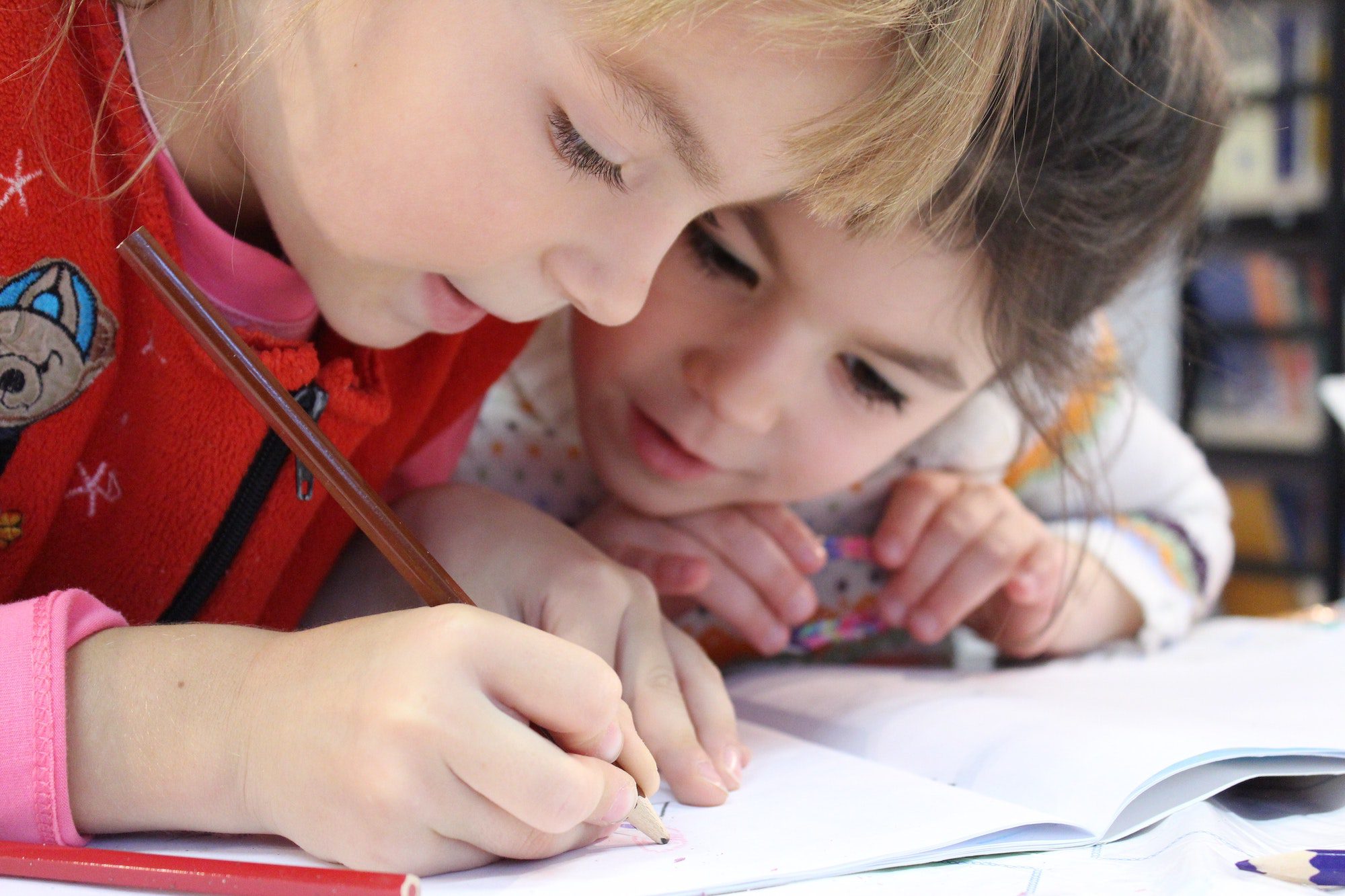 girls-writing-notebook-learning-cube academy-best-summer-camp-plano-texas girls-writing-notebook-learning-cube academy-best-summer-camp-plano-texas